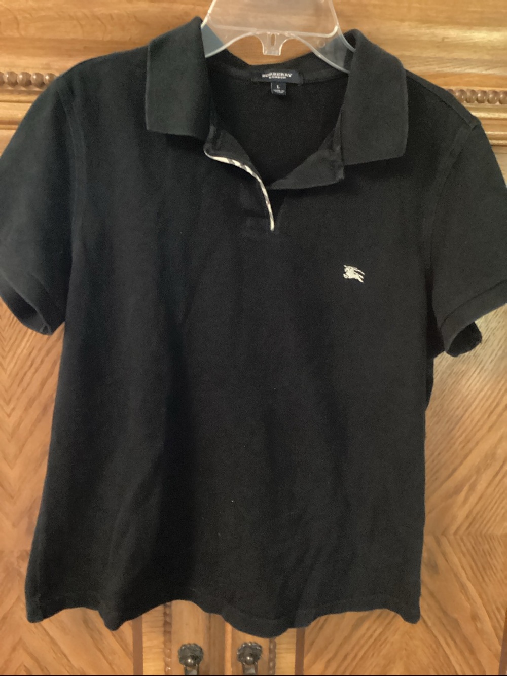 Burberry black polo shirt. Short sleeves, Size Large. EUC.
